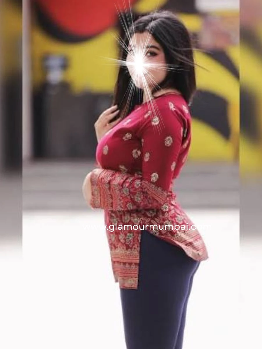 Rupali housewife escort profile photo in red attire.