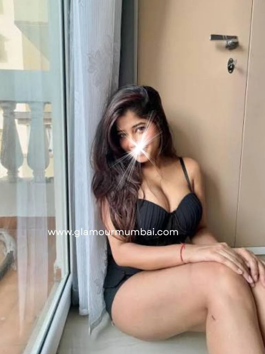 Kajal independent companion in black dress sitting near hotel balcony in Mumbai