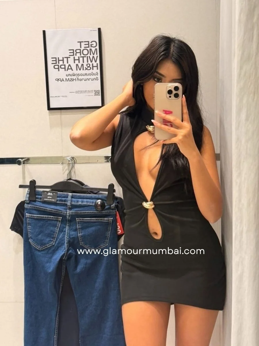 Roohi VIP escort posing in a stylish black outfit in a dressing room.